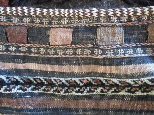 A VINTAGE/ANTIQUE HAND WOVEN MIDDLE EASTERN CAMEL SADDLE BAG IN NEED OF TLC