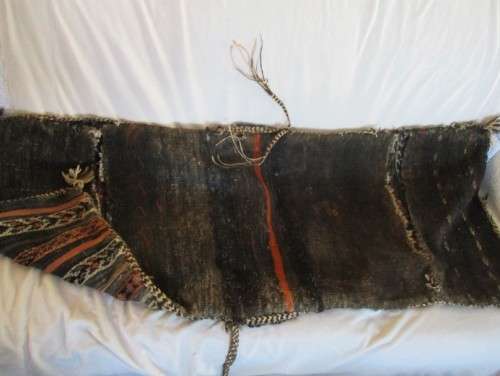 A VINTAGE/ANTIQUE HAND WOVEN MIDDLE EASTERN CAMEL SADDLE BAG IN NEED OF TLC