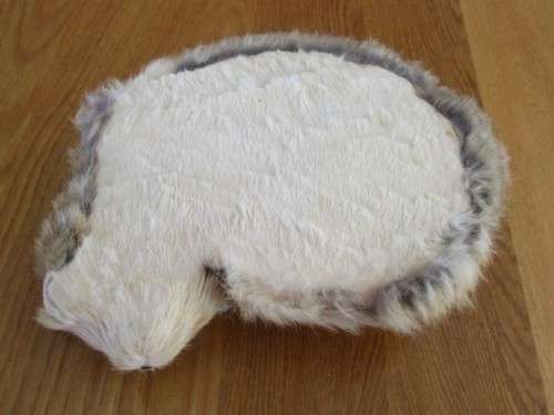 A REALISTIC SLEEPING CAT MADE FROM ARTIFICIAL "FUR"