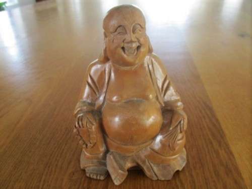 A NICE-SIZED CARVED WOODEN BUDDHA