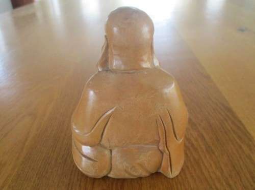 A NICE-SIZED CARVED WOODEN BUDDHA