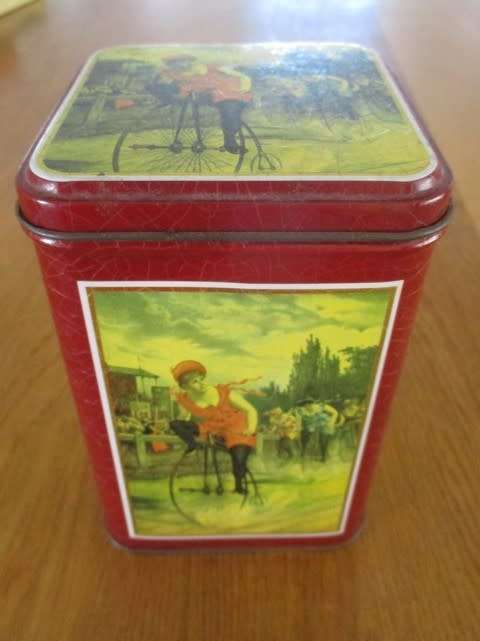 PRETTY COFFEE TIN WITH GIRL ON PENNY FARTHING BICYCLE