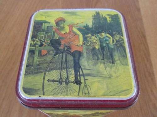 PRETTY COFFEE TIN WITH GIRL ON PENNY FARTHING BICYCLE