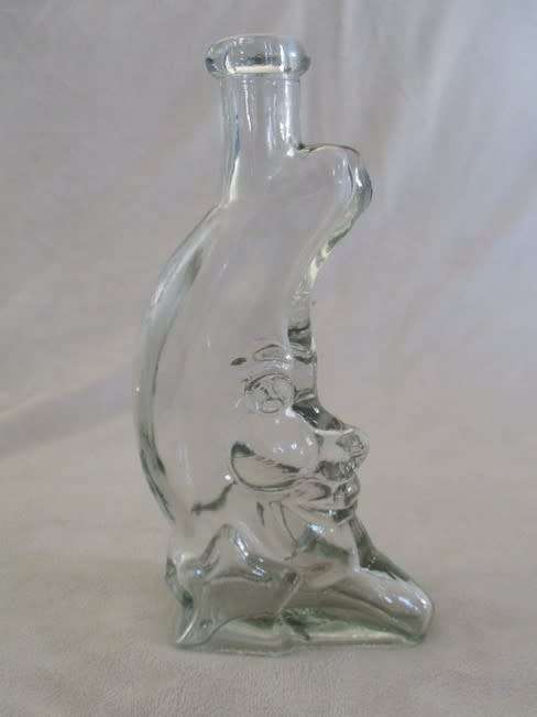 A CUTE CRESCENT MAN-IN-THE-MOON BOTTLE