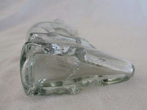 A CUTE CRESCENT MAN-IN-THE-MOON BOTTLE