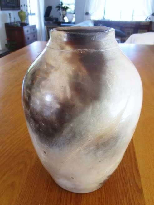 THERE IS SOMETHING SO NOT AVERAGE ABOUT THIS LARGE, HEAVY, BEAUTIFULLY GLAZED VASE