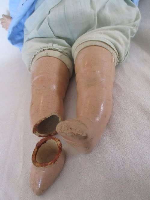 TWO ANTIQUE COMPOSITION AND TWO ANTIQUE POLISH DOLLS IN NEED OF TLC AND A NEW LIFE