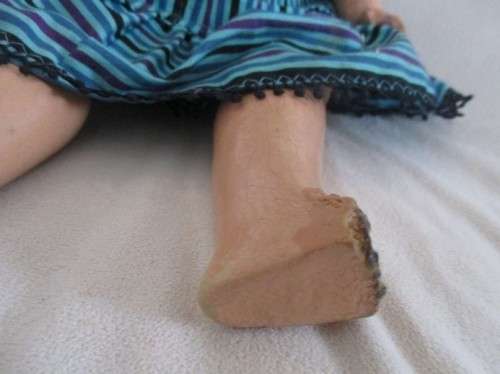 TWO ANTIQUE COMPOSITION AND TWO ANTIQUE POLISH DOLLS IN NEED OF TLC AND A NEW LIFE