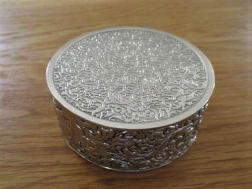 VERY DECORATIVE SILVER METAL TRINKET BOX WITH RED VELVET LINING (PLEASE DISREGARD REFLECTIONS)