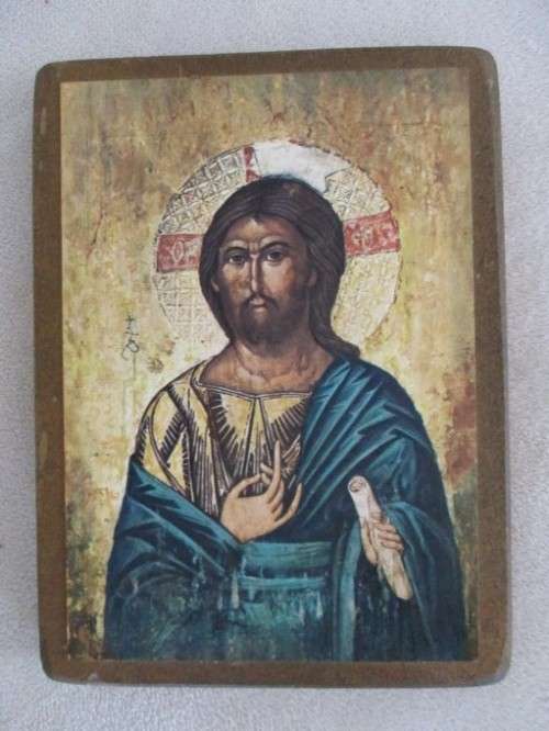 TWO RELIGIOUS ICONS MOUNTED ON WOOD