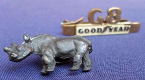 TWO VERY INTERESTING PINS - A VINTAGE SOPHOS  GOOD YEAR TIE PIN AND A RHINO PIN!!