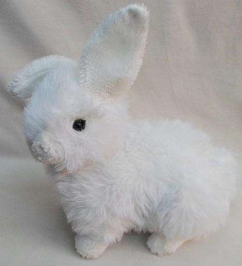 A LARGE SOFT WHITE REALISTIC BUNNY RABBIT WITH ONE EAR UP AND THE OTHER DOWN!!
