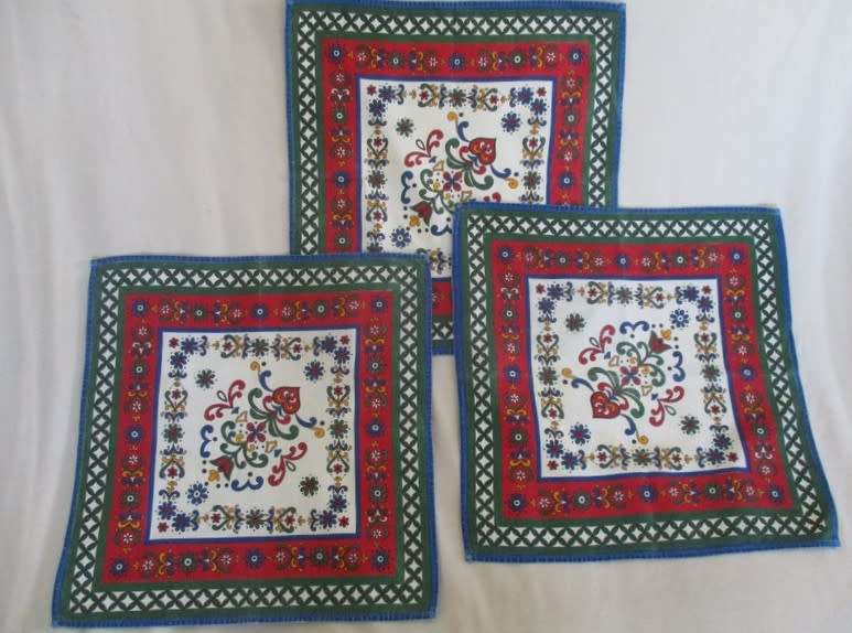 Three cheerful Austrian cloths with traditional designs