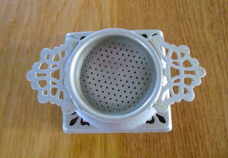 Vintage tea strainer and holder - made in England
