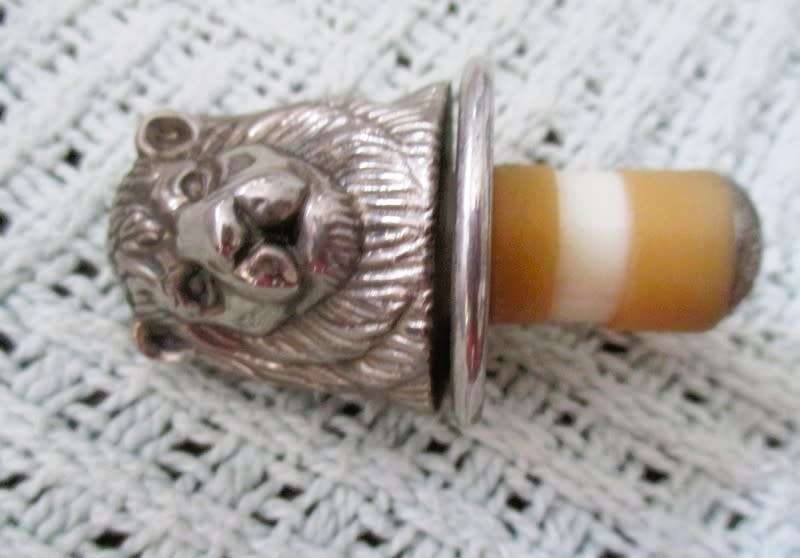 Handy bar items - two ornate metal bottle stoppers and a corkscrew