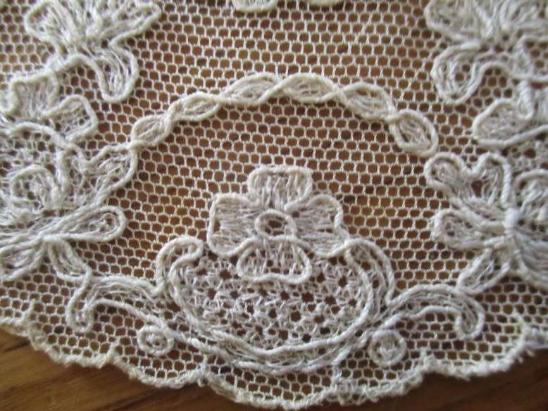 Such a special little find! Eight antique embroidered lace doilies with petit point tapestry centres