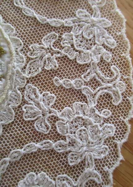 Such a special little find! Eight antique embroidered lace doilies with petit point tapestry centres