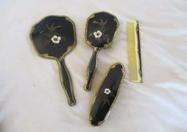 Vintage/antique hand painted enamel four piece Mona Lisa vanity brush set in original box