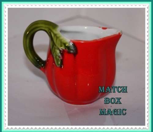 SMALL RED JUG IN THE SHAPE OF A VEGETABLE (D)