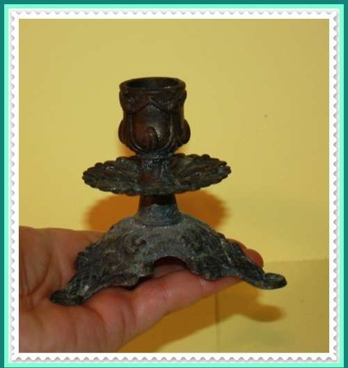 ORNATE METAL CANDLE STICK HAS NOT BEEN CLEANED