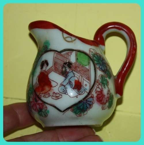 SMALL ORIENTAL JUG WITH LOVELY HOME THEME
