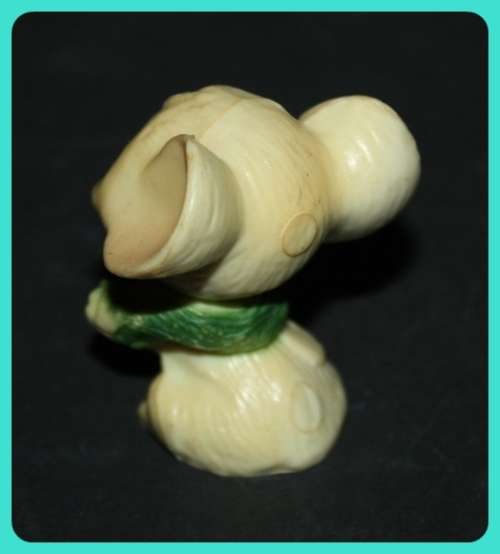 CUTE LITTLE MOUSE WITH BIG EARS WEARING A WREATH MADE FROM COMPOSITE PLASTIC