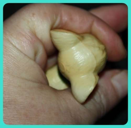 CUTE LITTLE MOUSE WITH BIG EARS WEARING A WREATH MADE FROM COMPOSITE PLASTIC