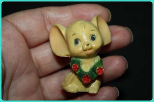 CUTE LITTLE MOUSE WITH BIG EARS WEARING A WREATH MADE FROM COMPOSITE PLASTIC