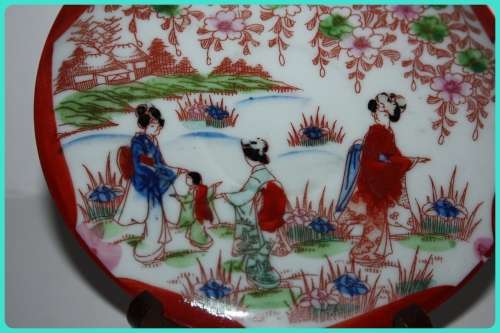 LOVELY ORIENTAL SAUCER WITH A GARDEN THEME