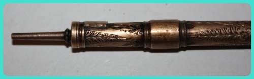 BEAUIFUL HAND ETCHED ITEM VERY OLD WITH INTRICATE DESIGN . I THINK IT IS A RETRACTABLE PENCIL