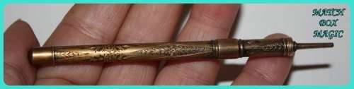 BEAUIFUL HAND ETCHED ITEM VERY OLD WITH INTRICATE DESIGN . I THINK IT IS A RETRACTABLE PENCIL