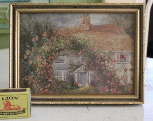 PICTURE OF COTTAGE  IN WOODEN FRAME