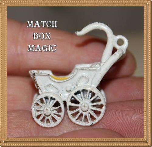 VINTAGE MINIATURE PRAM MADE OF METAL LOOKS VERY OLD