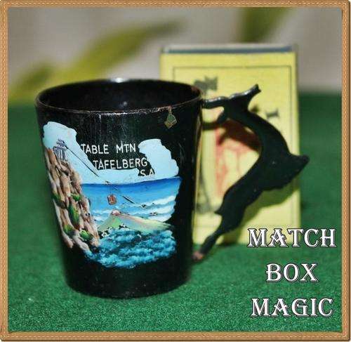 VINTAGE  METAL TOT GLASS WITH SPRINGBOK HANDLE AND HAND PAINTED VIEW OF TABLE MOUNTAIN AND CABLE CAR