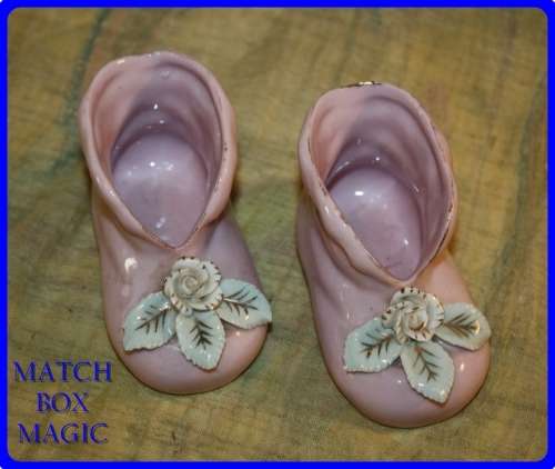 PAIR OF PINK BABY BOOTIES WITH RAISED FLORAL DETAIL