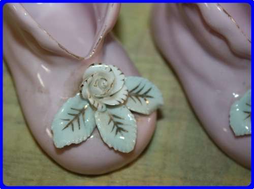 PAIR OF PINK BABY BOOTIES WITH RAISED FLORAL DETAIL