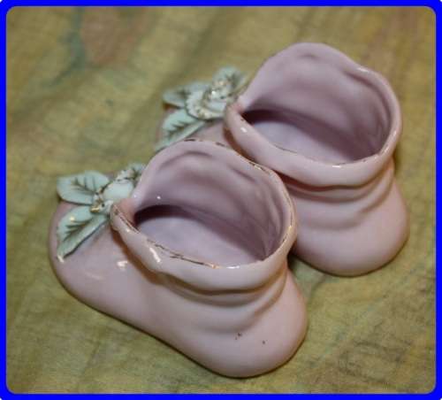 PAIR OF PINK BABY BOOTIES WITH RAISED FLORAL DETAIL
