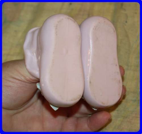 PAIR OF PINK BABY BOOTIES WITH RAISED FLORAL DETAIL