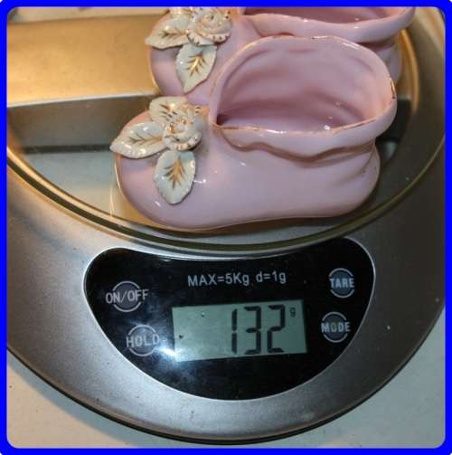 PAIR OF PINK BABY BOOTIES WITH RAISED FLORAL DETAIL