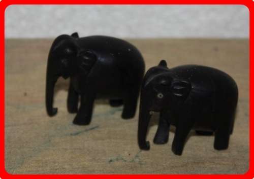 TWO SMALL WOODEN ELEPHANTS  HEIGHT 4CM LENGTH 5CM