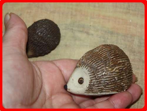 NICLEY MADE PAIR OF POTTERY HEDGEHOGS