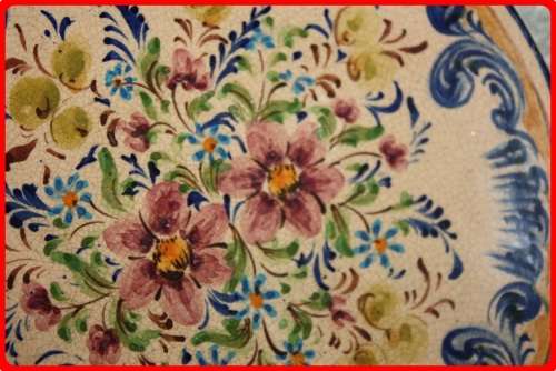 VINTAGE HAND PAINTED FLORAL WALL PLATE FROM PORTUGAL  STAMPED ON BACK