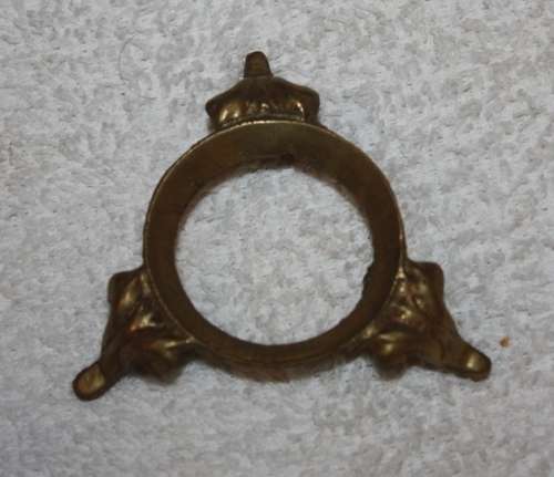 LARGE DECORATIVE CERAMIC EGG . WHITE BACKGROUND WITH BLUE RIBBON AND FLORAL DETAIL ON A LOOSE METAL