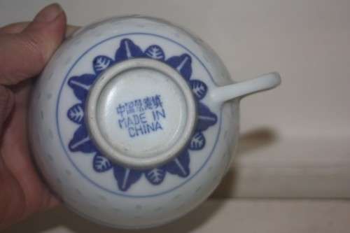 BLUE AND WHT CUP AND SAUCER ORIENTAL DESIGN WITH DRAGON MOTIEF