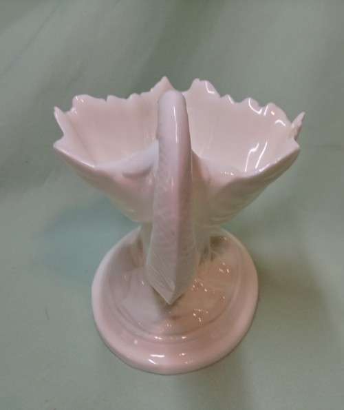 Royal Wocester dolphin supporting a clam shell ornament