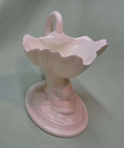 Royal Wocester dolphin supporting a clam shell ornament