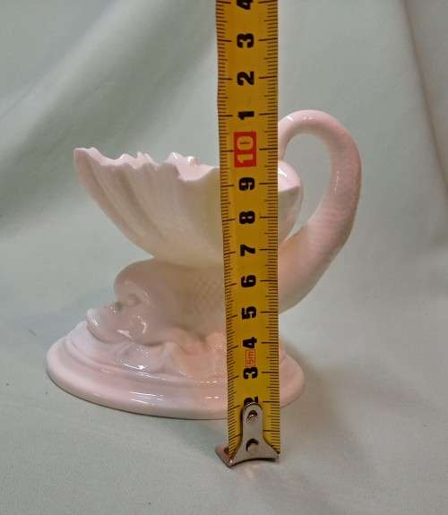 Royal Wocester dolphin supporting a clam shell ornament