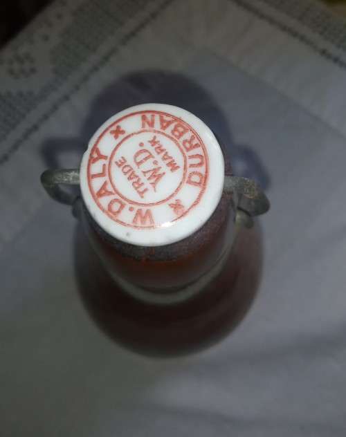 Antique W. Daly, Durban ceramic ginger beer bottle with lid