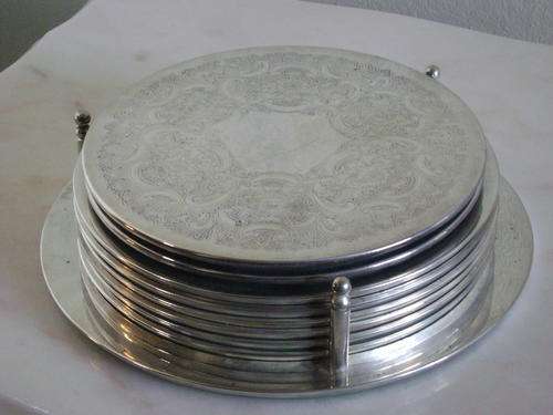 COLLECTION OF 8 VINTAGE SILVER PLATED PLACE MATS IN PLACE MAT HOLDER