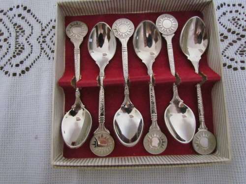 6 SILVERPLATED SPOONS WITH SUN IMAGE  STILL IN BOX.